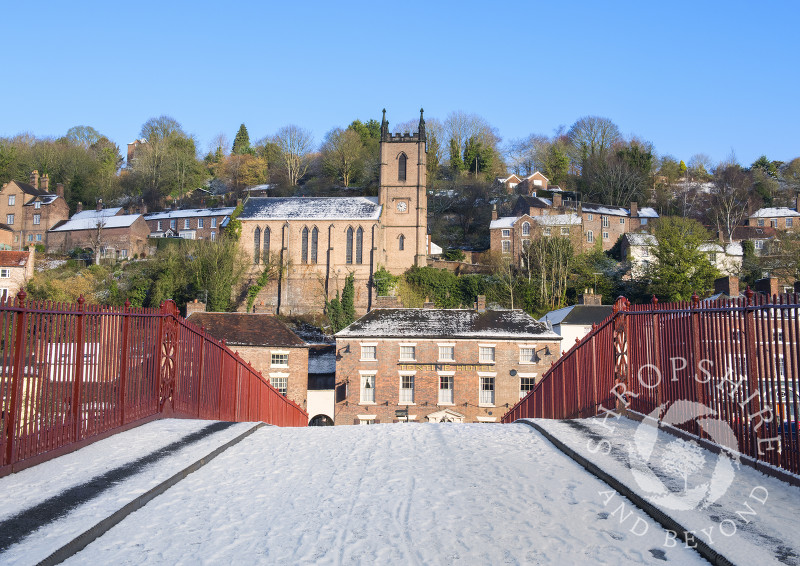 Snow on the Iron Bridge with St Luke's Church, Ironbridge, Shropshire.