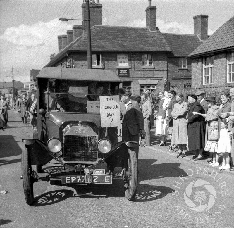 A float passes the Beehive public house in Shifnal, Shropshire, during the town's carnival procession in the 1950s.