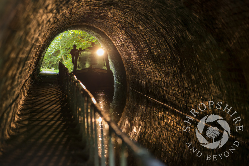 A canal boat passing through Ellesmere Tunnel on the Llangollen Canal in Shropshire.