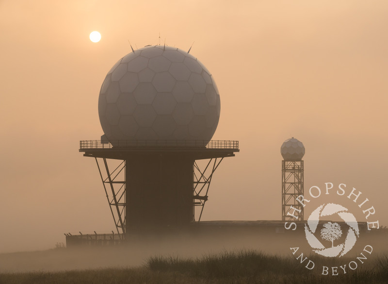 Early morning mist surrounds the radar domes on Titterstone Clee Hill, Shropshire.