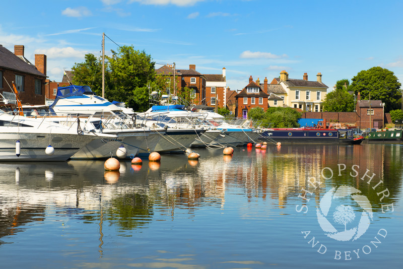 A line of boats moored in front of Stourport Yacht Club at Stourport-on-Severn, Worcestershire, England.