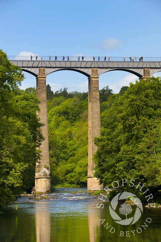 People walking along Pontcysyllte Aqueduct, above the River Dee, Wales.