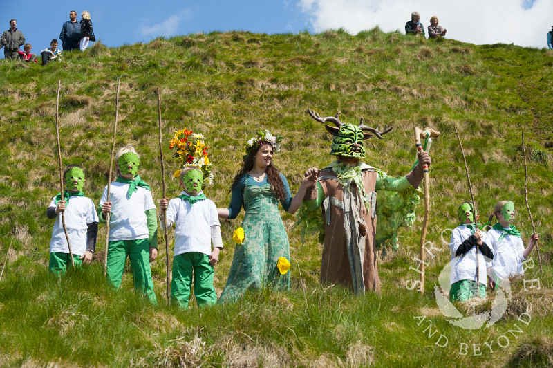 The May Queen and the Green Man with their attendants at the Clun Green Man Festival, Shropshire.