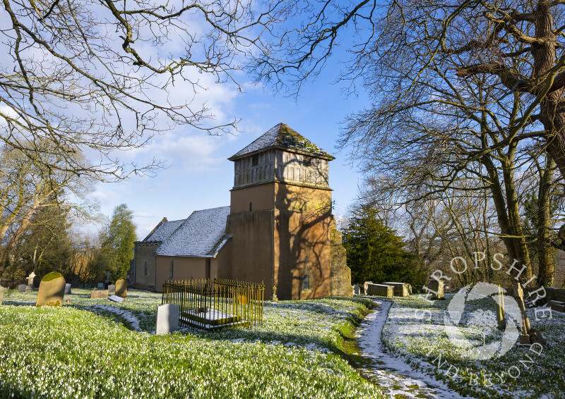 Snowdrops, snow and sunshine at St James' Church, Shipton, Shropshire.