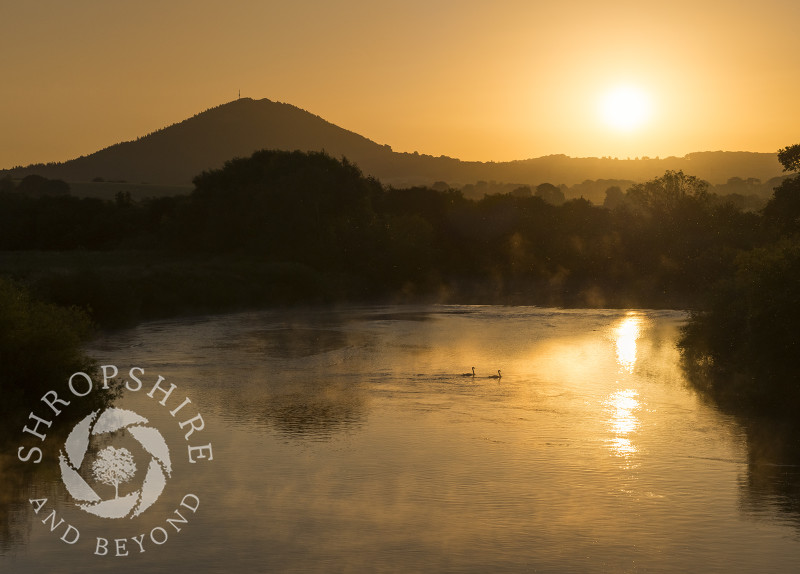 Sunrise over the River Severn and the Wrekin seen from Cressage Bridge, Shropshire.