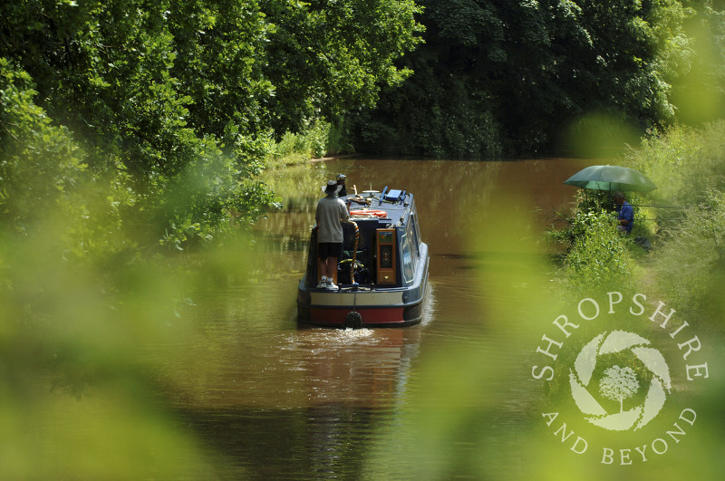 A canal boat on the Shropshire Union Canal at Tyrley Locks, near Market Drayton, Shropshire, England.