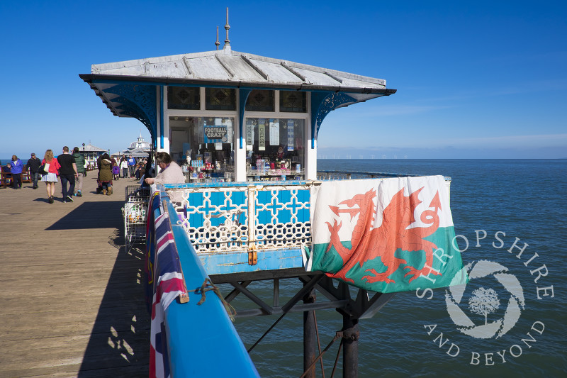 A Welsh flag displayed outside a kiosk on Llandudno Pier, North Wales.