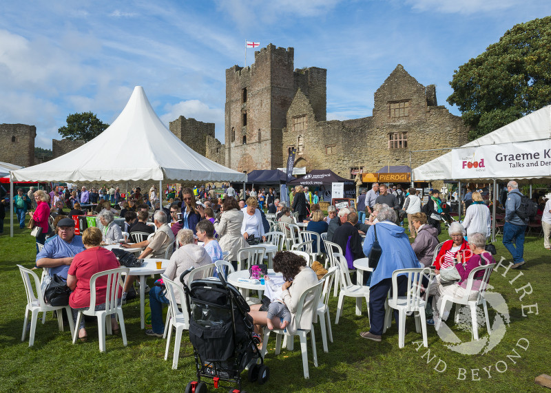 Visitors to the 2016 Ludlow Food Festival enjoy the sunshine in the grounds of Ludlow Castle, Shropshire.