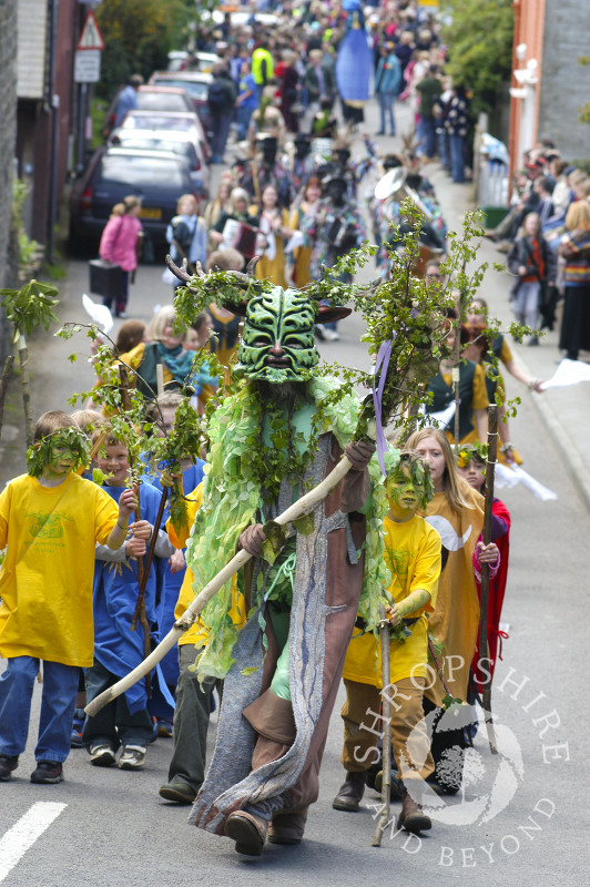 The Green Man heads a procession at the Clun Green Man Festival, Shropshire.