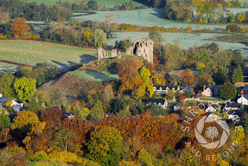 A frosty autumn sunrise highlights the town and castle ruins at Clun, Shropshire.