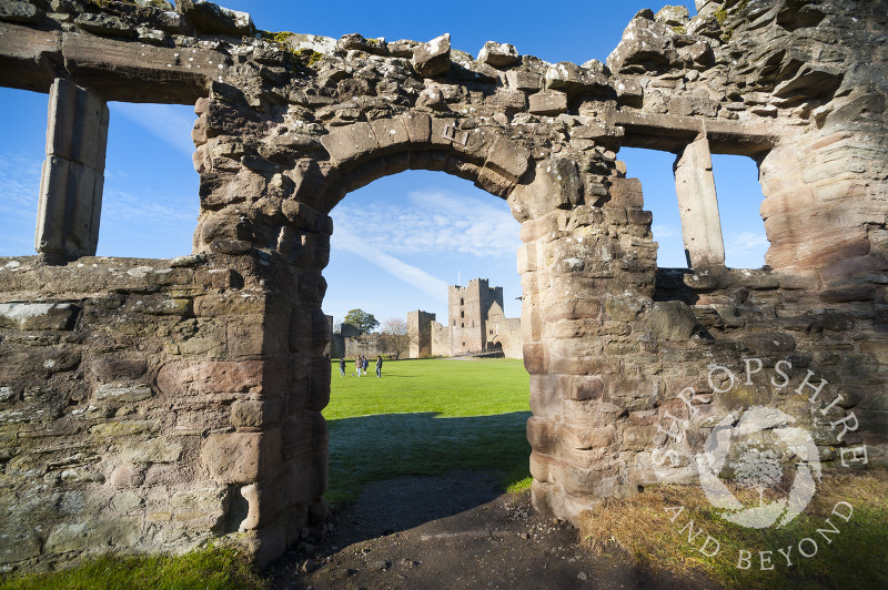 A view of the Outer Bailey at Ludlow Castle seen through a ruined doorway, Ludlow, Shropshire, England.