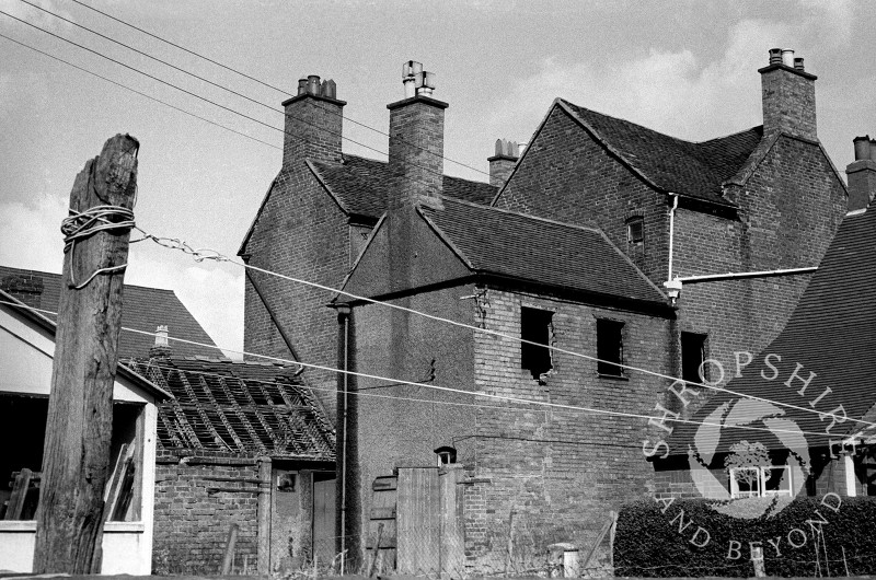 A house adjacent to the Wheatsheaf public house awaits demolition in Broadway, Shifnal, Shropshire, in 1966.