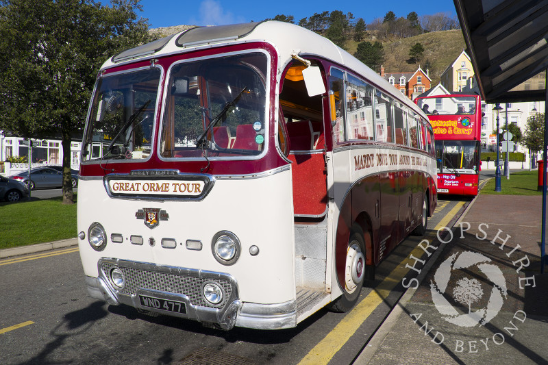 A tour bus on the seafront at Llandudno, North Wales.