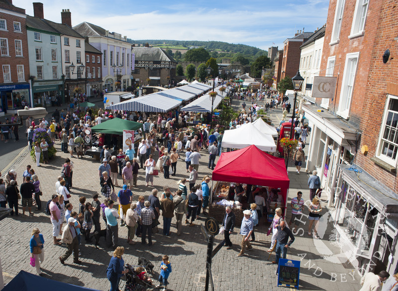 Visitors throng the stalls in Castle Square during the Ludlow Food Festival, Shropshire, England.