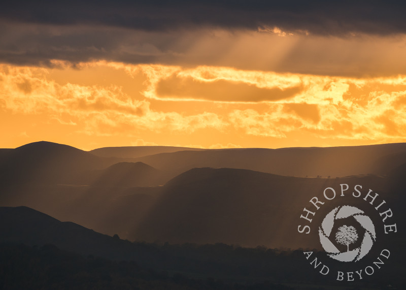Dramatic evening light on the Long Mynd, seen from the Wrekin, Shropshire.