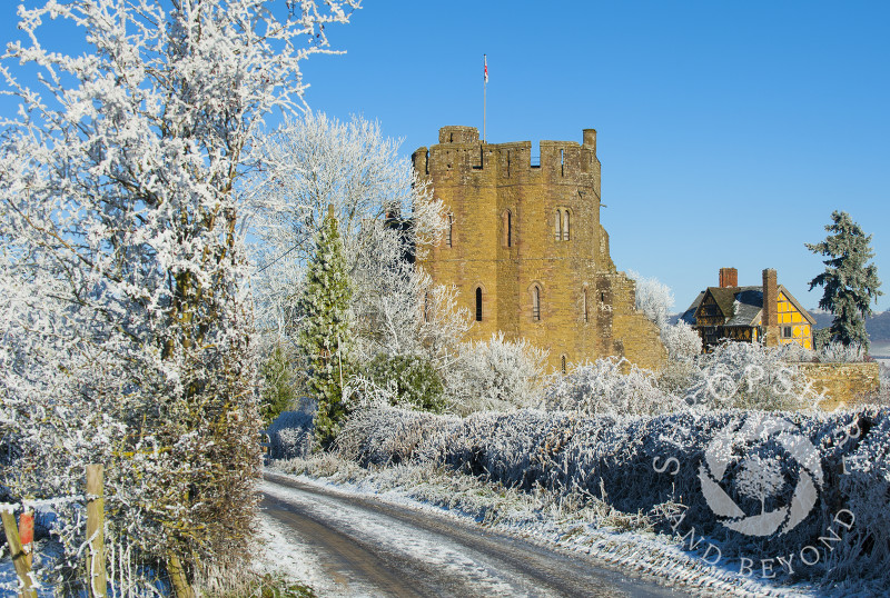A frosty lane near the South Tower and Gatehouse of Stokesay Castle, Shropshire, England.
