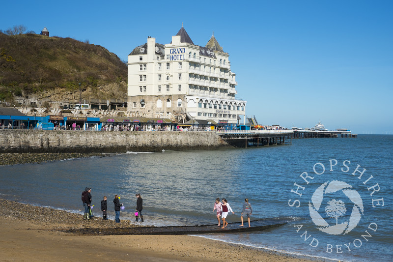 The Grand Hotel overlooks the pier and seafront at Llandudno, north Wales.