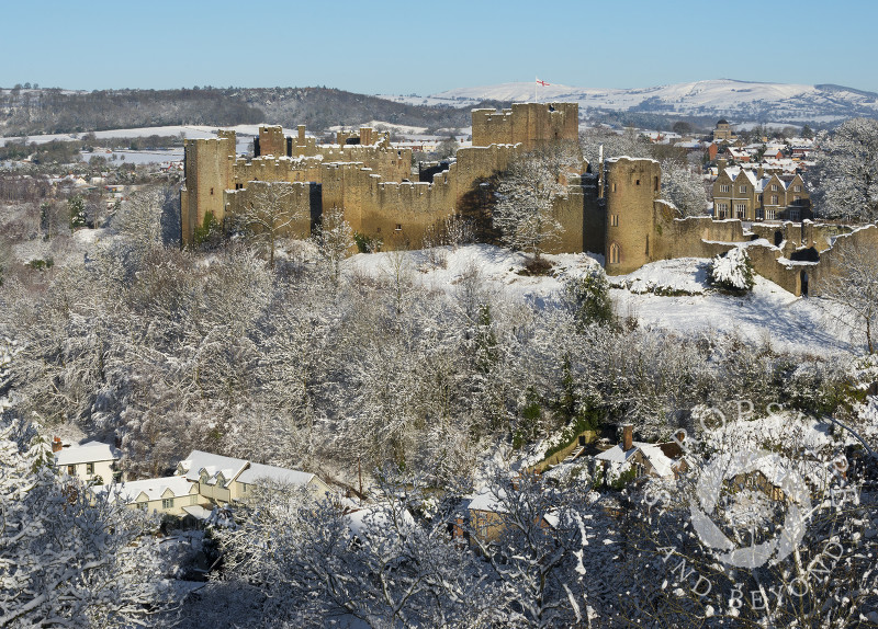 Ludlow Castle under a blanket of snow seen from Whitcliffe Common, Shropshire.