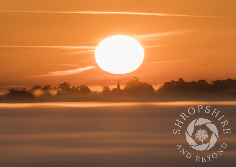 Sunrise over St Andrew's Church at Welsh Frankton, seen from Old Oswestry Hill Fort, Shropshire.