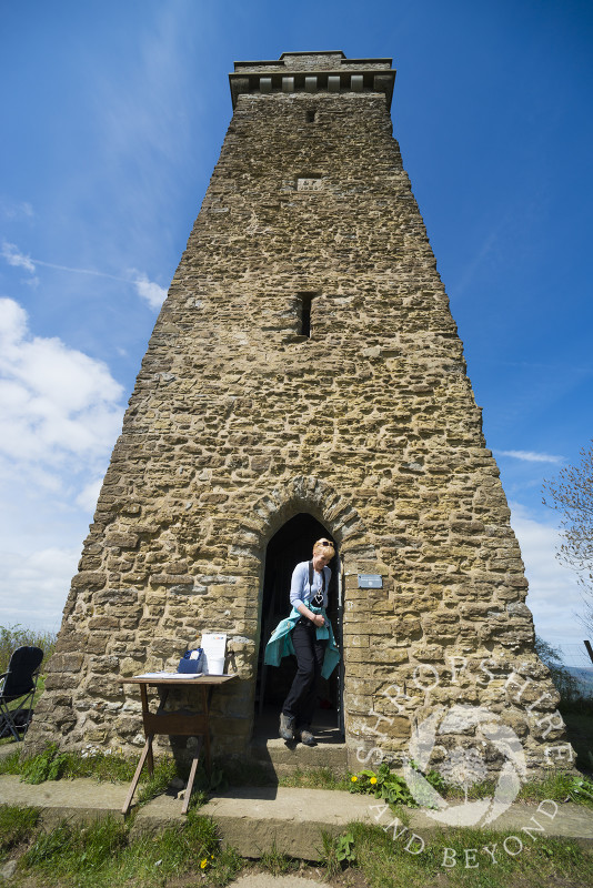 A visitor exits Flounders' Folly on Callow Hill near Craven Arms, Shropshire, England.