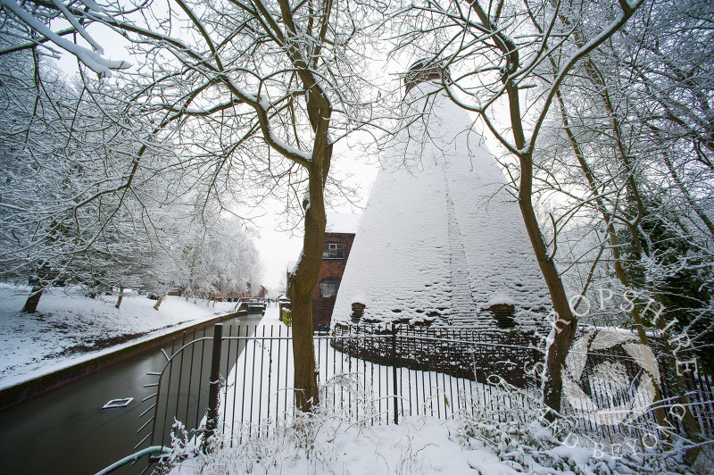 Snow-covered bottle kiln at the Coalport China Museum, one of the Ironbridge Gorge Museums, at Coalport, Shropshire.