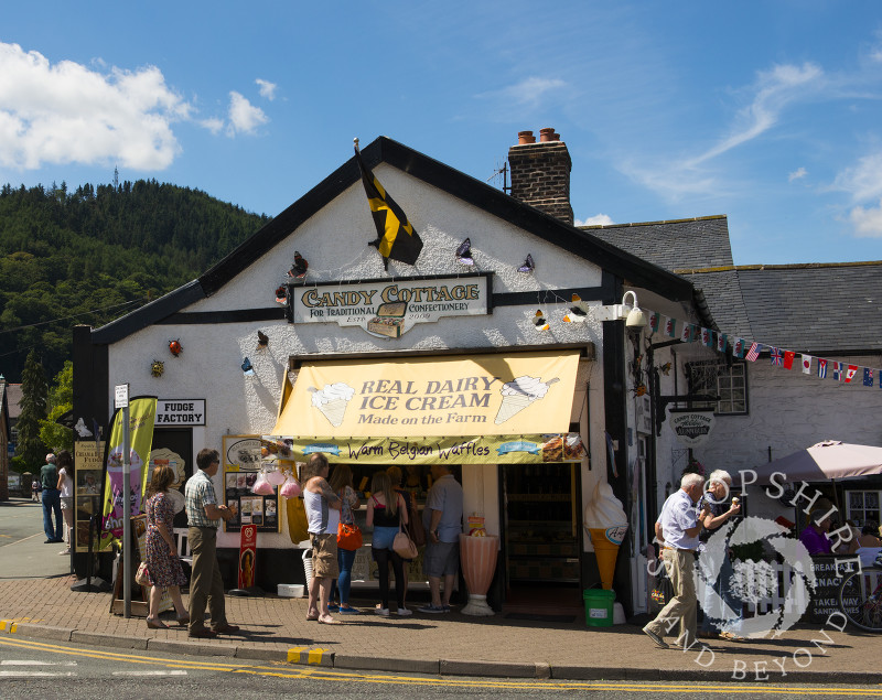 People queue outside an ice cream shop in Llangollen, Denbighshire, Wales.