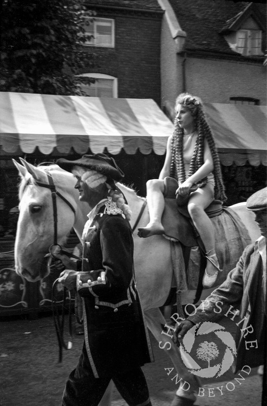 Lady Godiva on horseback at the annual carnival parade in Shifnal, Shropshire, during the 1950s.