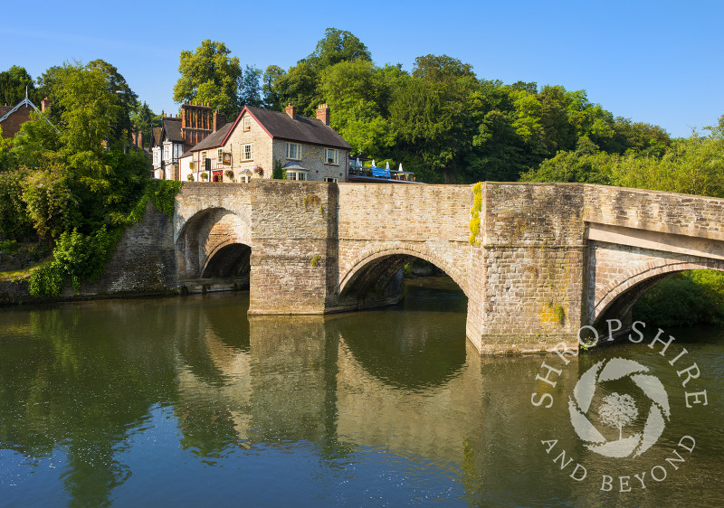 Ludford Bridge reflected in the waters of the River Teme at Ludlow, Shropshire, England.