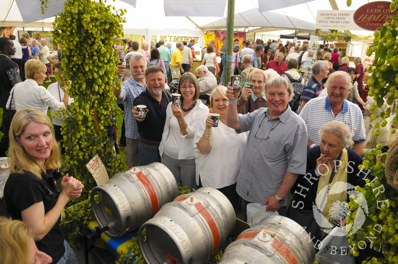 Visitors to the Hobsons Brewery stall at Ludlow Food Festival, Shropshire, England.