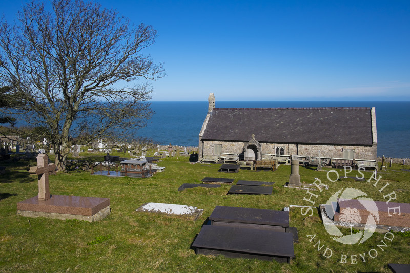 The Church of St Tudno with its churchyard and the adjacent town cemetery on the Great Orme, Llandudno, Wales.