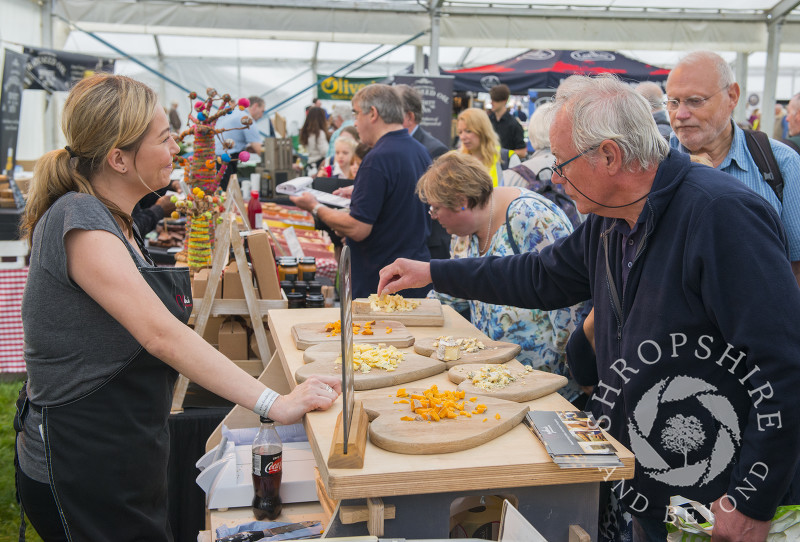 Visitors sample a selection of cheeses at Ludlow Food Festival, Shropshire.