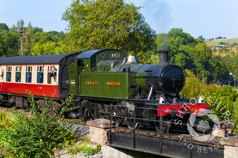 A GWR 4500 Class locomotive leaves Highley Station, Severn Valley Railway, Shropshire, England.