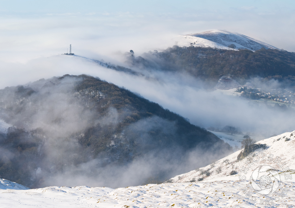 Magical landscape of snow, sun and mist