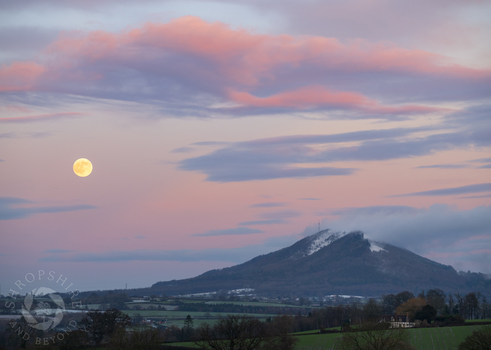 Pink glow of moonrise over the Wrekin