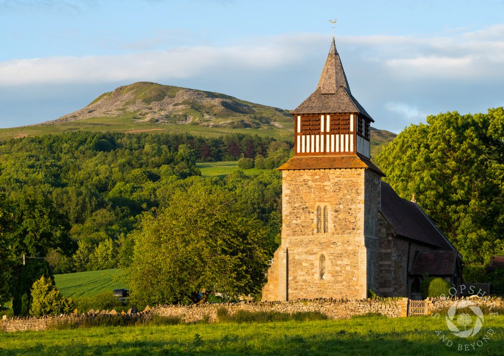 Golden glow on church and Titterstone Clee