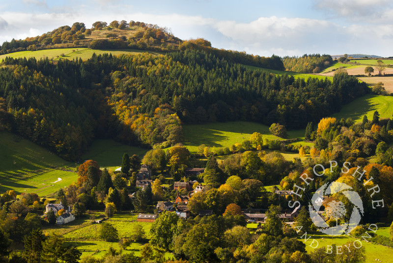 The village of Hopesay nestles beneath Burrow Hill iron age hill fort in autumn, near Craven Arms, Shropshire, England.