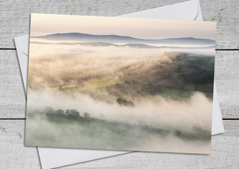 Misty sunrise over Wilstone Hill and Wenlock Edge, seen from Caer Caradoc, Shropshire.