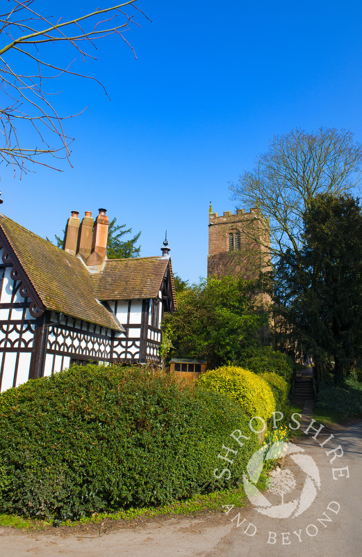 St Mary's Church and a black and white cottage in Sheriffhales, near Shifnal, Shropshire.