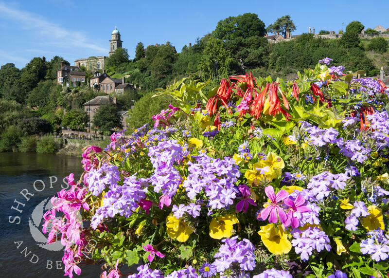 Flowers on the bridge at Bridgnorth, with St Mary's Church, Shropshire.