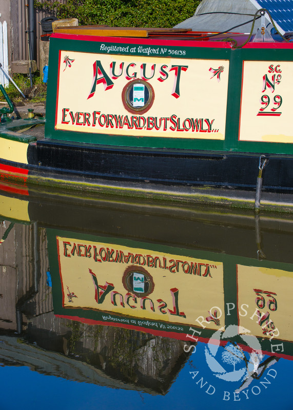 Canal boat reflections at Norbury Junction on the Shropshire Union Canal, Staffordshire, England.