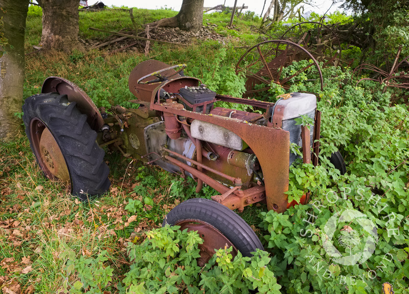 An abandoned Ferguson tractor in a field above the village of Snailbeach on the Stiperstones, Shropshire.