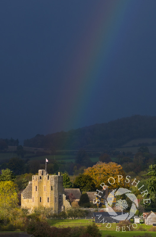 Autumn sunshine and rainbow at Stokesay Castle, Shropshire.