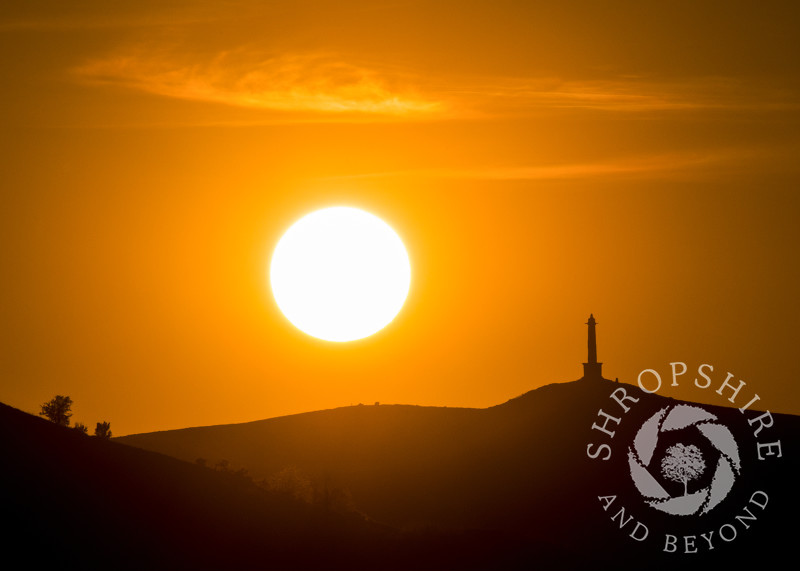 Sunset over Rodney's Pillar on the Breidden Hills, Powys, Wales.