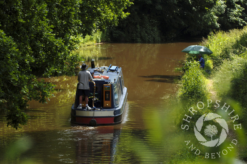 A canal boat on the Shropshire Union Canal at Tyrley Locks, near Market Drayton, Shropshire, England.