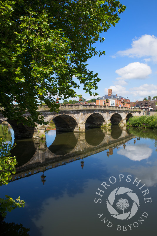 Welsh Bridge reflected in the River Severn at Shrewsbury, Shropshire, England.