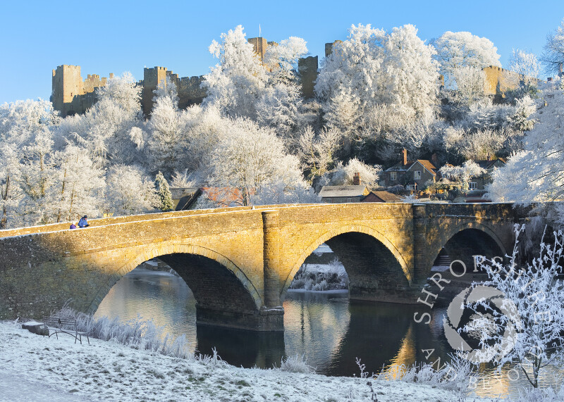 Dinham Bridge and Ludlow Castle under a layer of hoar frost covers Ludlow, Shropshire, England.