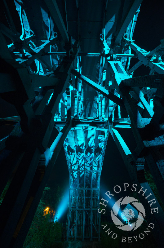 The view from beneath the Iron Bridge at Ironbridge, Shropshire, England. The bridge was illuminated as part of the Night of Heritage Light, celebrating UNESCO world heritage sites.