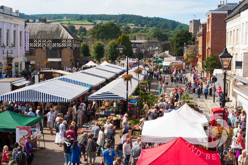 Market stalls in Castle Square during Ludlow Food Festival, Shropshire, England.