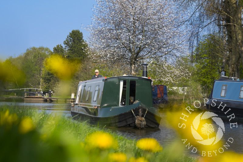 A canal boat on the Trent and Mersey canal near Fradley Junction, Staffordshire, England.