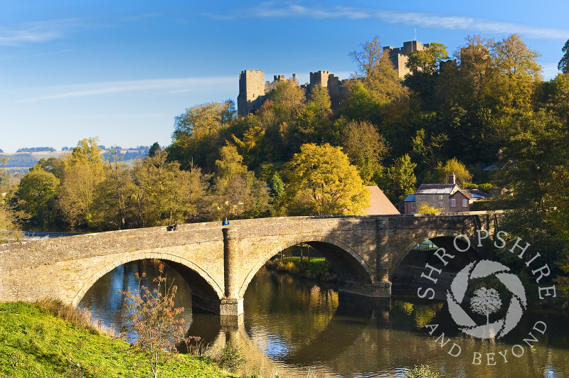Dinham Bridge and Ludlow Castle in autumn reflected in the River Teme at Ludlow, Shropshire.